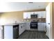 Updated kitchen features granite countertops, stainless appliances and modern cabinetry at 16010 S Elizabeth Pl, Arizona City, AZ 85123