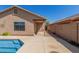 A private backyard with a pool and covered patio at 16508 N 114Th Dr, Surprise, AZ 85378