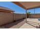 A backyard with a covered patio and gravel landscaping at 16508 N 114Th Dr, Surprise, AZ 85378