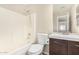 This bathroom has a shower-tub, toilet, mirror, and vanity with modern faucet at 16508 N 114Th Dr, Surprise, AZ 85378