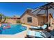 Enjoy the Arizona sunshine with this beautiful outdoor pool, lounge chairs and a covered patio at 16508 N 114Th Dr, Surprise, AZ 85378