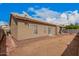 Backyard view featuring desert landscaping, block wall, and covered patio area at 1773 E Constitution Dr, Chandler, AZ 85225