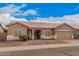 Charming single-story home with a tile roof, low maintenance landscaping, and an attached two-car garage at 1773 E Constitution Dr, Chandler, AZ 85225