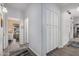 Bright hallway leading to a sunlit bedroom and other areas of the home at 1773 E Constitution Dr, Chandler, AZ 85225