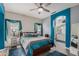 Cozy main bedroom with a ceiling fan, laminate floors, and an ensuite bathroom with a double vanity at 1773 E Constitution Dr, Chandler, AZ 85225