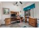 Home office offering a large desk, wood cabinetry, and a comfortable workspace at 1773 E Constitution Dr, Chandler, AZ 85225