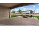 Outdoor living space featuring a fire pit with seating, pavers, and artificial turf at 19372 E Timberline Rd, Queen Creek, AZ 85142