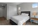 Bedroom showcasing a bed, two side tables with lamps, and neutral decor to give a cozy feel at 19372 E Timberline Rd, Queen Creek, AZ 85142