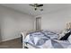 Cozy bedroom with ceiling fan, neutral paint and tile floors at 19372 E Timberline Rd, Queen Creek, AZ 85142