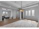Bright living area features hardwood floors, recessed lighting, and modern light fixture at 19372 E Timberline Rd, Queen Creek, AZ 85142