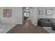 Open-concept living room featuring hard surface floors, neutral walls, and stylish decor at 19372 E Timberline Rd, Queen Creek, AZ 85142