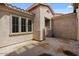 Private outdoor patio featuring a stucco walls, covered porch, and view of the window at 19372 E Timberline Rd, Queen Creek, AZ 85142