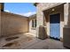 Private outdoor patio featuring a blue door, stucco walls, and covered porch at 19372 E Timberline Rd, Queen Creek, AZ 85142