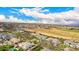 Expansive aerial shot featuring lush landscapes, well-manicured lawns, and close proximity to the neighborhood at 20690 E Sunset Dr, Queen Creek, AZ 85142