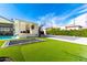 Expansive backyard with tennis court, trampoline, and pool, perfect for outdoor fun at 20690 E Sunset Dr, Queen Creek, AZ 85142