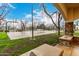 Community basketball court surrounded by mature trees, with a partial view from a stone-columned structure at 20690 E Sunset Dr, Queen Creek, AZ 85142