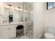 Bathroom showcasing walk-in shower, marble countertop, and ample lighting at 20690 E Sunset Dr, Queen Creek, AZ 85142