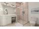 Modern bathroom with pink tile shower and vanity with a seating area at 20690 E Sunset Dr, Queen Creek, AZ 85142