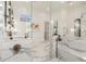 Luxury bathroom showcasing a dual sink vanity, marble walls, glass shower and soaking tub at 20690 E Sunset Dr, Queen Creek, AZ 85142