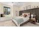 Cozy bedroom featuring a comfortable bed, window seat, and stylish decor at 20690 E Sunset Dr, Queen Creek, AZ 85142