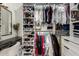 Organized walk-in closet with shelves and hanging rods for ample storage at 20690 E Sunset Dr, Queen Creek, AZ 85142