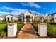 Stunning entrance with brick walkway, well-manicured gardens, and address markers, enhancing curb appeal at 20690 E Sunset Dr, Queen Creek, AZ 85142