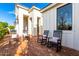 Charming front porch with classic rocking chairs offering a cozy spot to relax outdoors at 20690 E Sunset Dr, Queen Creek, AZ 85142