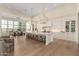 Gourmet kitchen with a large island and dining area offers plenty of space for entertaining at 20690 E Sunset Dr, Queen Creek, AZ 85142