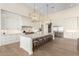 Spacious white kitchen featuring a large island with seating, stainless steel appliances, and modern finishes at 20690 E Sunset Dr, Queen Creek, AZ 85142