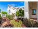 Exterior of home with colorful landscaping, including lush greenery and blooming flowers at 20690 E Sunset Dr, Queen Creek, AZ 85142