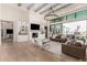 Spacious living room boasts a fireplace, built-in shelving, and seamless indoor-outdoor flow at 20690 E Sunset Dr, Queen Creek, AZ 85142