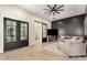 Cozy seating area with a black accent wall and double doors offers a luxurious retreat at 20690 E Sunset Dr, Queen Creek, AZ 85142