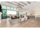 Open-concept living space with a bar area provides seamless access to outdoor pool area at 20690 E Sunset Dr, Queen Creek, AZ 85142