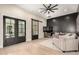 Relaxing seating area with a black accent wall and double doors provides a luxurious retreat at 20690 E Sunset Dr, Queen Creek, AZ 85142