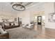 Bright living room featuring high ceilings, hardwood floors, and a gourmet kitchen with an island at 20690 E Sunset Dr, Queen Creek, AZ 85142