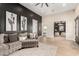 Comfortable living room featuring stylish decor and easy access to a well-lit office space at 20690 E Sunset Dr, Queen Creek, AZ 85142
