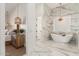 Spacious main bathroom featuring a soaking tub, tiled shower, and a door leading to bedroom at 20690 E Sunset Dr, Queen Creek, AZ 85142