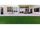 Spacious patio with modern furniture and outdoor dining area, perfect for entertaining at 20690 E Sunset Dr, Queen Creek, AZ 85142
