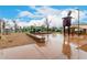 Community playground featuring climbing structure and vintage water tower at 20690 E Sunset Dr, Queen Creek, AZ 85142