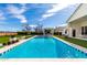 Backyard oasis showcases a sparkling pool and modern outdoor area with a sleek cabana, perfect for entertaining at 20690 E Sunset Dr, Queen Creek, AZ 85142