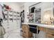 Beautiful walk-in closet with vanity, drawers and shelving for clothes and accessories at 20690 E Sunset Dr, Queen Creek, AZ 85142
