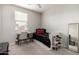 Cozy bedroom with carpet, desk, storage bed, ceiling fan, and natural light at 2571 S Melvin St, Gilbert, AZ 85295