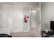 Bright bedroom showcasing closet, light gray walls, and open doorway to other room at 2571 S Melvin St, Gilbert, AZ 85295