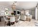 Elegant dining area featuring a decorative chandelier and views into the cozy living room at 2571 S Melvin St, Gilbert, AZ 85295