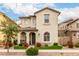 Charming two-story home with a well-manicured front yard, covered porch and desert landscaping at 2571 S Melvin St, Gilbert, AZ 85295