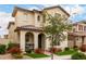 Lovely two-story home with covered porch, manicured lawn and beautiful desert landscaping at 2571 S Melvin St, Gilbert, AZ 85295