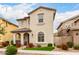 Well-maintained two-story house with decorative front yard, covered porch and drought-resistant landscaping at 2571 S Melvin St, Gilbert, AZ 85295