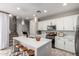 Well-lit kitchen featuring stainless steel appliances, a central island, and modern pendant lights at 2571 S Melvin St, Gilbert, AZ 85295