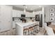 Bright kitchen featuring a large island, modern appliances, and stylish stools at 2571 S Melvin St, Gilbert, AZ 85295