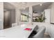 Elegant home office with designer chandelier, built in cabinets and view to adjacent room at 2571 S Melvin St, Gilbert, AZ 85295